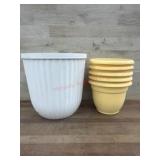 Seven Plastic Plant Pots