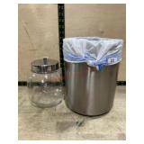 Stainless trash can and glass jar with lid