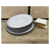 Grey and white ceramic plates and stone coasters