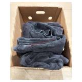 Box of well worn black towels