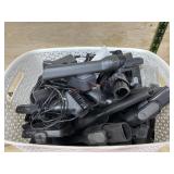 White basket of various vacuum cleaner wands and