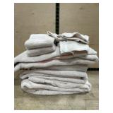 4 Tan bath towels/ 3 hand towels and 2 wash rags