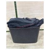 Basket of  black hand towels and wash rags