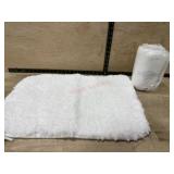 2- White bath mats (one new)  20x30