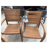 2 damaged Catalina teak wood stacking arm chairs
