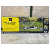Yellow and Black Oscillating Sprinkler