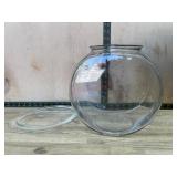 Clear glass fish bowl and odd clear lid