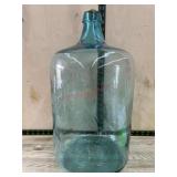 Green glass 5 gallon bottle