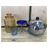 Flat with amber canister, ice bucket and blue