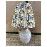 White ceramic bed side lamp with floral shade