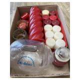 Flat with candles and glass piggy bank