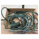 Green 25 foot extension cord with three way plug