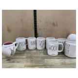 7 Rae Dunn coffee mugs and 1 small canister