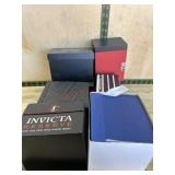Flat of 5 watch cases and watch company books