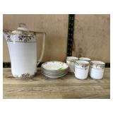 Gold and white Nippon tea pot with 5 saucers and