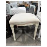 Cream upholstered ottoman