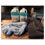 Pot and pan detergent. Mop head and black towel