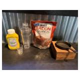 Flat of mustard. Shakers. Bacon crumbles. Tiny