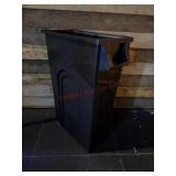 Black plastic rectangular trash can