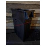 Black plastic rectangular trash can
