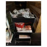 Rolling cart of stir sticks. Portion cups.