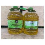 Two Plastic Jugs of Canola Oil