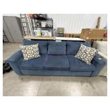 Used upholstered sofa with matching cushions