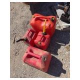 Four Assorted Red Plastic Gas Cans, Used