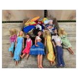 6 Barbie and other Dolls with Assorted Clothes