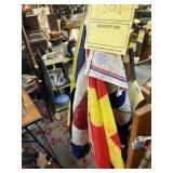ANTIQUE GAS STATION STAND WITH FLAGS