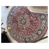 ROUND RED & BLACK ORIENTAL RUG - COUNTRY OF ORIGIN