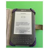 KINDLE D00901 IN PURPLE CASE WITH LIGHT