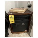 RED STONE ELECTRIC HEATER WITH WOOD CASING ON WHEE