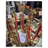 GOLD STANCHIONS WITH RED VELVET ROPES