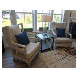 cream wingback chairs with blue pillows