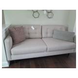 TAN SOFA W/ (2) PILLOWS