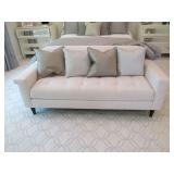 CREAM COLORED LOVE SEAT W/ (4) PILLOWS