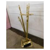 Gold colored fireplace cleaning set: broom -