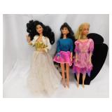 Three 1966 Barbie dolls in outfits