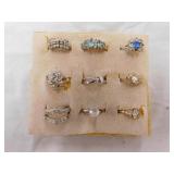 Eight Silvertone costume rings