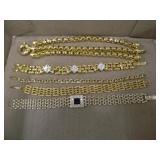 Five bright goldtone bracelets, all unmarked Five bright goldtone bracelets, all unmarked