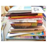 Stack of books, mostly unwrapped, 20 or more Stack of books, mostly unwrapped, 20 or more