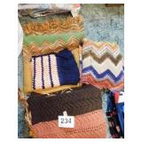 Four crocheted/knitted throws