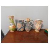 Four floral vases/pitchers, double handle made in