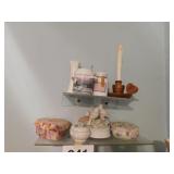 Two shelves of tins - trinkets - candles - vase -