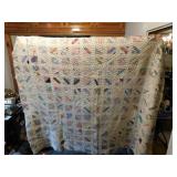 Vintage multicolor quilt with rough edges, few