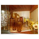 Assortment of amber colored glassware: pitcher Assortment of amber colored glassware: pitcher
