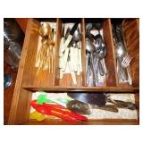 Contents of silverware drawer: various