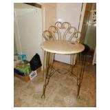 Vintage vanity chair with padded seat, metal back