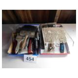 Two flats of paint brushes - caulk gun - wallpaper